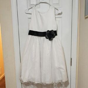 Elegant White Kids Dress with Black Flower Accent